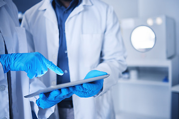 Image showing Tablet, research and hands with a team working on science in a lab together for innovation or growth. Doctor, teamwork or medical with a black man and woman scientist at work in a laboratory