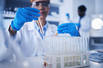 Image showing Science, test tube in hands and black woman in laboratory for research, medical study and experiment. Healthcare, pharmaceutical and female scientist with liquid vial, medicine and vaccine in clinic