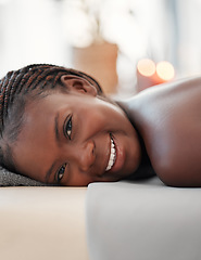 Image showing Relax, spa and portrait of black woman in massage bed for wellness, peace or luxury zen. Face, girl and resort for body care, therapy and pamper treatment, happy and smile with stress free relaxation