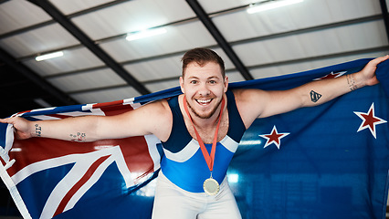 Image showing Man, athlete and flag on shoulder with medal, smile and sports for portrait, competition and pride. New Zealand champion, happy and winner with gold, celebrate or success in global gymnastics contest