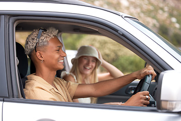 Image showing One beautiful blonde caucasian woman and her hispanic boyfriend enjoying a road trip. An attractive young female and mixed race male taking a drive. Enjoying the open road