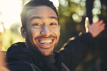 Image showing Hiking man, portrait or selfie in forest, nature woods or trees environment for travel blog, social media or profile picture. Smile, happy or hiker face in photography for Japanese fitness influencer