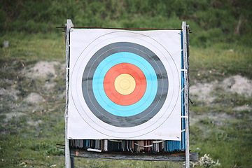 Image showing Bullseye target paper, outdoor and board at shooting range for weapon training, aim and accuracy. Sports, archery and poster for gun, bow and arrow at academy for police, army or security for goal