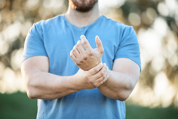 Image showing Injury, sports and man with wrist pain from a workout, exercise accident and sprain from cardio. Fitness, emergency and athlete with carpal tunnel syndrome, inflammation and injured arm from training