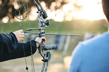 Image showing Archery, closeup and target training with an instructor on field for hobby, aim and control. Arrow, practice and archer people together outdoor for hunting, precision and weapon, shooting competition