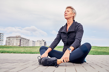 Image showing Woman, breathing and stretching exercise at park, sky mockup and ground for training in Miami. Senior female, breathe and fitness outdoor for workout, sports and meditation for healthy runner mindset