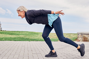 Image showing Workout, senior woman and running at park for energy, wellness or cardio marathon. Happy elderly female, exercise and runner outdoor for sports training, healthy fitness and smile for action movement