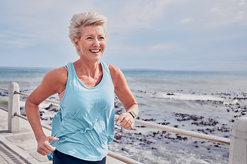 Image showing Senior woman, fitness and running at beach promenade, sky mockup and energy of health, wellness and workout. Elderly female, exercise and runner at ocean for happy sports, cardio training or marathon