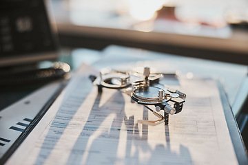 Image showing Ophthalmology, test glasses and paperwork on desk for results, diagnosis and analysis for service. Eye care office, documents and phoropter for eyesight health, wellness and exam with medical admin