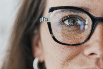 Image showing Half face, eyes and woman with glasses for optical healthcare, vision or perception. Female, portrait and spectacles of eye care, optometry and frames for cosmetic fashion, lens choice or sight