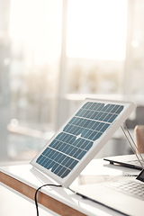 Image showing Solar panel, office and design on table for renewable energy, electricity tech or engineering innovation. Photovoltaic, eco friendly or sustainable charge for laptop, job and electric infrastructure