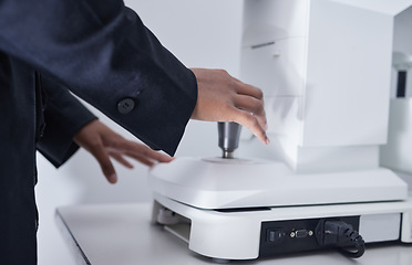 Image showing Ophthalmologist, glaucoma and optometrist hands on machine for eye exam for vision care, health and wellness. Closeup, professional and healthcare specialist test lenses for optometry in clinic