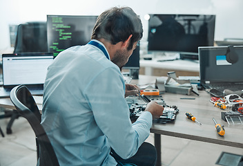 Image showing Man, it and technician fixing motherboard in engineering workshop for PC database update. Worker, CPU and circuit board for repair, maintenance or software upgrade in information technology industry