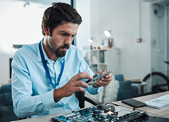 Image showing Man, circuit and hard drive in repair workshop for maintenance, computer tech or industry with focus. Technician, motherboard and information technology at desk for electronics, engineering and tools