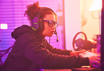 Image showing Computer games, young girl and headset in home for esports, online rpg and virtual competition. Female gamer, internet streamer and gaming on headphones in neon lighting, live streaming tech or gen z