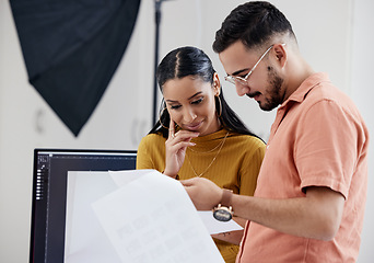 Image showing Photographers, man and woman with documents, review and satisfaction in studio, happy and art creativity. Photography, employees and coworkers with paperwork, happiness and teamwork with results