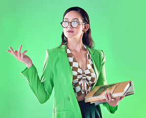 Image showing Woman, books and teacher mockup in studio isolated on a green background. Gen z, education and smart female professor with product placement, advertising or marketing space while carrying textbooks.