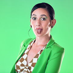 Image showing Portrait, fashion and woman with tongue out in studio isolated on a green background. Comic face, funny and gen z female model with makeup, cosmetics or beauty aesthetics, trendy or stylish suit.