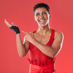 Image showing Hands, mockup and portrait of gen z man pointing in studio for makeup, fashion and punk aesthetic on red background. Hand, gesture and product placement with face of mexican male advertising space