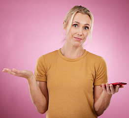 Image showing Portrait, senior woman and confused with smartphone, questioning and against studio background. Face, mature female and lady with cellphone, frown or doubt with body language, notification or alert