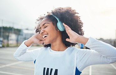 Image showing Fitness, freedom and music for black woman training at court, happy and relax with wellness track. Sports, podcast and girl smile with radio, playlist or song during exercise and workout