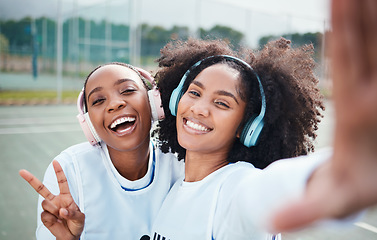 Image showing Friends, selfie and black women in portrait, netball and sports with team on court outdoor, smile and peace hand sign. Face, headphones and gen z with fitness, train for game and happy in picture