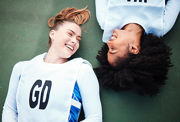 Image showing Friends, sports and overhead with women lying on the ground at a court to relax after training. Fitness, team or smile with a happy female athlete and friend resting together while finished exercise