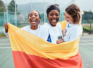 Image showing Winning netball, flag and sports team celebration, excited or celebrate competition award, victory winner or court game. Germany people, teamwork achievement and portrait of athlete happy for success