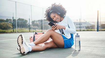 Image showing Netball sports, phone music and athlete listening to mp3 radio, audio podcast or song after training workout. Laughing on court, online digital headphones and black woman streaming funny meme video
