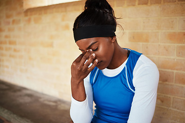 Image showing Headache, fitness and black woman in pain during run, exercise or workout against brick wall background. Sports, migraine and girl suffering with ache, discomfort and fatigue during cardio routine