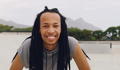 Image showing Happy, smile and portrait of black man in skate park for fitness, freedom and summer break. Sports, hobby and happiness with skater and relax in urban outdoors for skating, weekend and free time