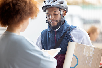 Image showing Black man, box and delivery for female customer service, package or signing on tablet for order in city. African American male courier employee delivering cargo to woman with touchscreen in ecommerce