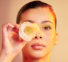 Image showing .Beauty, makeup and portrait of woman with flower for luxury cosmetics, skincare products and fashion. Neon studio, creative art and face of girl with plant for self care, glamour and satisfaction.