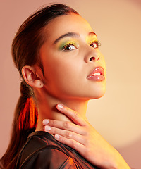 Image showing Face, woman and color makeup for aesthetic, creative skincare and cool trend on studio background. Portrait, female model and glitter cosmetics on eyes for beauty, fashion glow and facial creativity