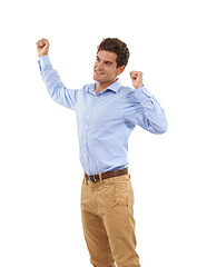 Image showing Winner, fist pump and man isolated on a white background for winning, success and celebration bonus, yes and smile. Celebrate, goal achievement and cheering business person or excited model in studio