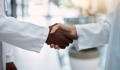 Image showing Doctor, handshake and partnership in healthcare, agreement or deal for collaboration, teamwork or unity. Hand of medical professionals shaking hands for meeting, greeting or success in solidarity