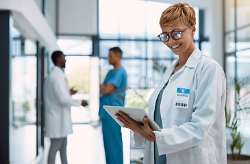 Image showing Woman, doctor and tablet in healthcare research at hospital for innovation, software or schedule planning. Happy female medical professional on touchscreen in online search, browsing or communication