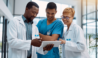 Image showing Doctor, team and tablet in healthcare planning for research, idea or meeting on technology at hospital. Happy group of doctors with touchscreen for medical data, collaboration or teamwork strategy