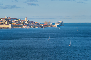 Image showing View of Lisbon view over Tagus river with yachts and boats on sunset. Lisbon, Portugal