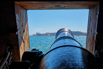 Image showing View out of a gunport in hull of the ship on the gun deck over the gun cannon muzzle in