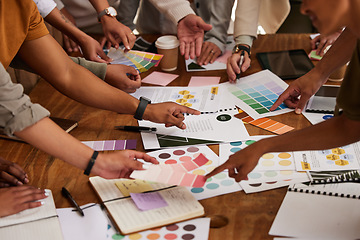 Image showing Creative, hands and color palette on table in meeting for planning, brainstorming or design strategy at office. Hand of group interior designers in teamwork, project plan or swatch ideas for startup