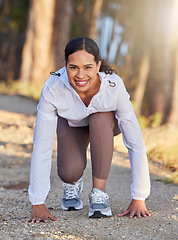 Image showing Fitness, nature or runner ready to start running workout, sports exercise or cardio training outdoors. Wellness, forest or happy girl with commitment, resilience or motivation for exercising in race