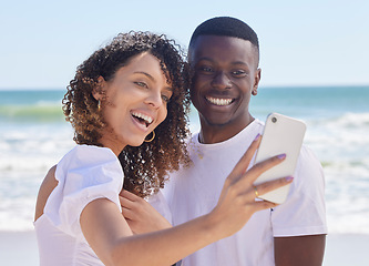 Image showing Black couple smile, selfie and sea water with a woman and man together for social media profile picture. Love, care and summer travel of young people outdoor with freedom on a holiday with happiness