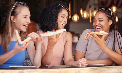 Image showing Woman, friends and laughing for pizza, food or eating at funny restaurant together in friendship. Happy hungry women laugh and smile for fun date, socializing or bonding at cafe enjoying Italian meal