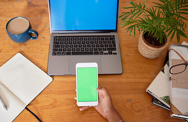 Image showing Green screen, laptop and phone in hands for mobile app, multimedia mockup and product placement space. Student planning with smartphone mock up for social media marketing, communication or ux design