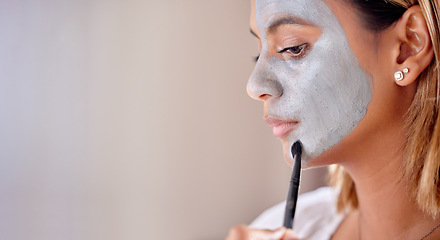 Image showing Woman brush clay makeup on face, mask and detox beauty benefits with mockup wall space. Young female apply charcoal skincare product, facial cosmetics and aesthetic cleaning for dermatology wellness