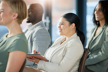 Image showing Seminar audience, crowd and business people listening at presentation conference, training workshop or trade show event. Happy woman writing notes, group meeting and team listen to tradeshow speech