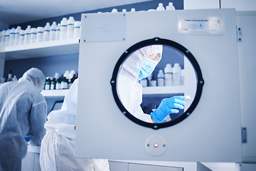 Image showing Science incubator, lab safety gear and biotechnology security for a medical research experiment. Virus analysis, pharmaceutical study and vaccine chemical innovation in laboratory with scientist team