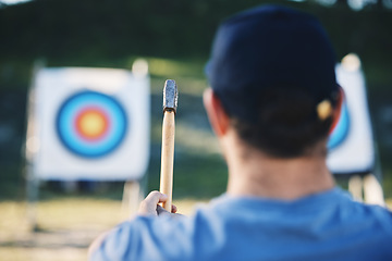 Image showing Sports, bullseye and man with axe for target on range for training, exercise and hunting competition. Extreme sport, fitness and male archer aim with tomahawk weapon for practice, games and adventure