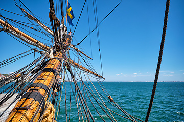 Image showing Bowspirit of old wooden sail ship with lots of rope gear